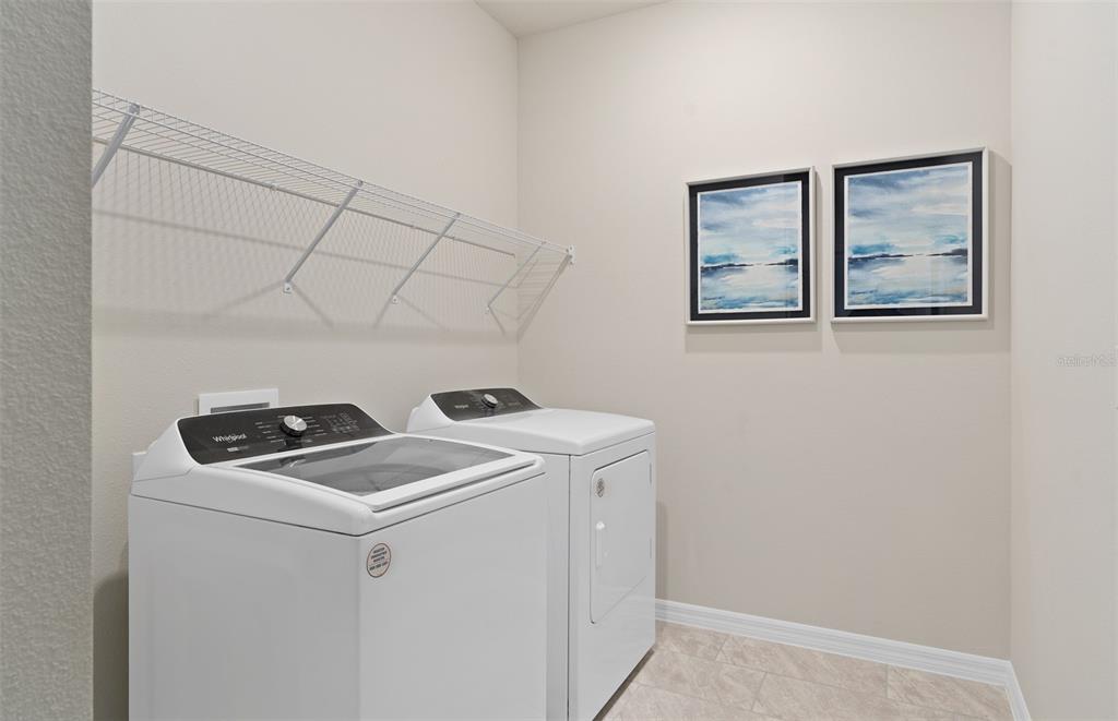15918 Calm Key Loop Clermont, FL 34714 - Photo 28 of 57 a utility room with dryer and washer