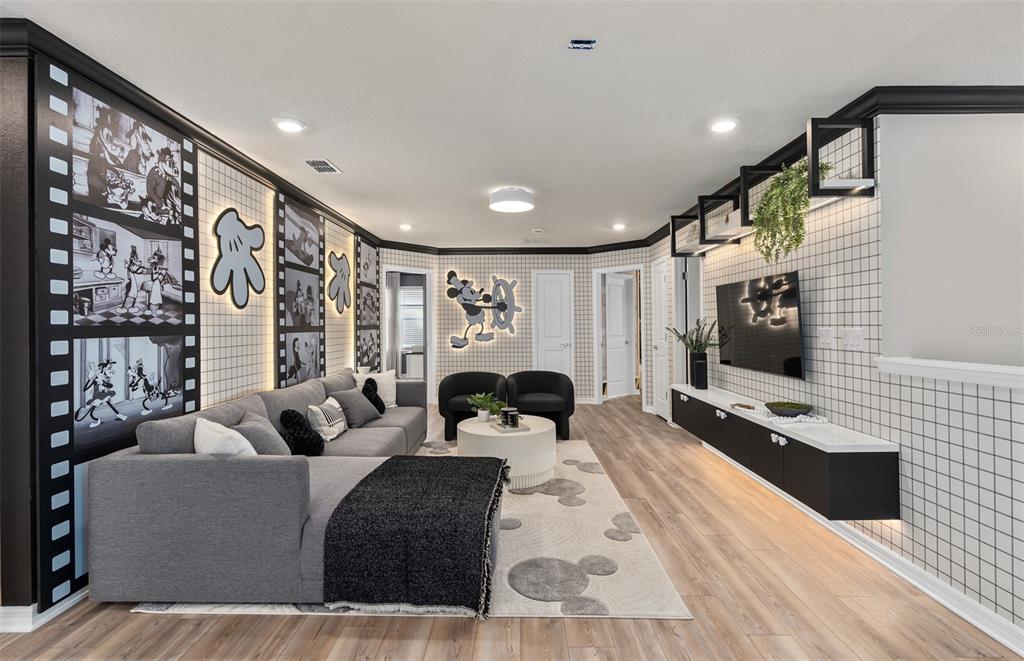 15918 Calm Key Loop Clermont, FL 34714 - Photo 30 of 57 a living room with furniture and a flat screen tv