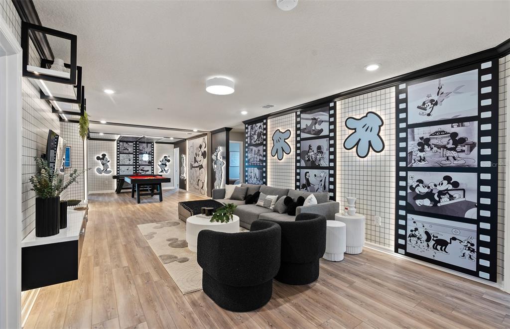 15918 Calm Key Loop Clermont, FL 34714 - Photo 31 of 57 a living room with furniture and a flat screen tv