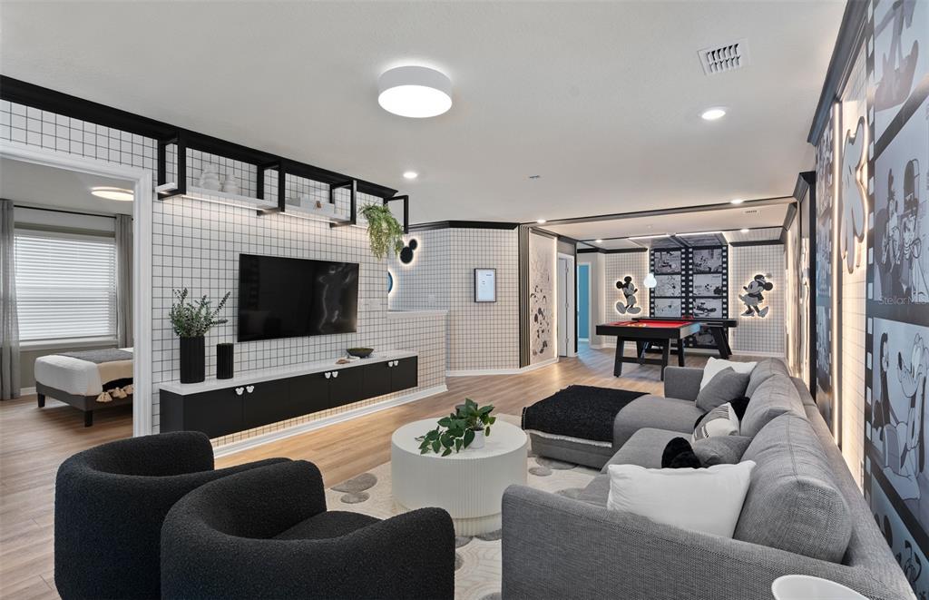 15918 Calm Key Loop Clermont, FL 34714 - Photo 32 of 57 a living room with furniture and a flat screen tv