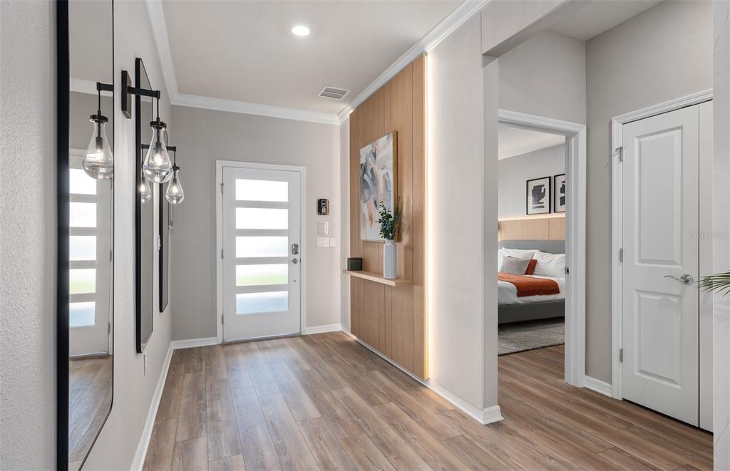 15918 Calm Key Loop Clermont, FL 34714 - Photo 4 of 57 a view of a hallway view with wooden floor and staircase