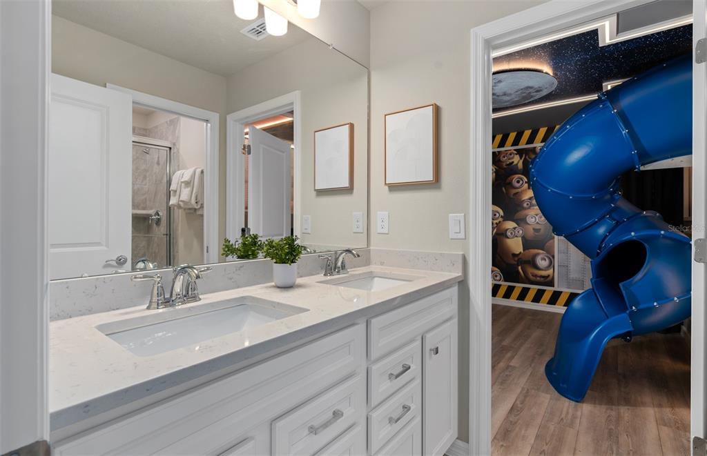 15918 Calm Key Loop Clermont, FL 34714 - Photo 41 of 57 a bathroom with a sink and a mirror