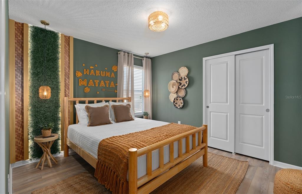 15918 Calm Key Loop Clermont, FL 34714 - Photo 44 of 57 a bedroom with a bed and a window