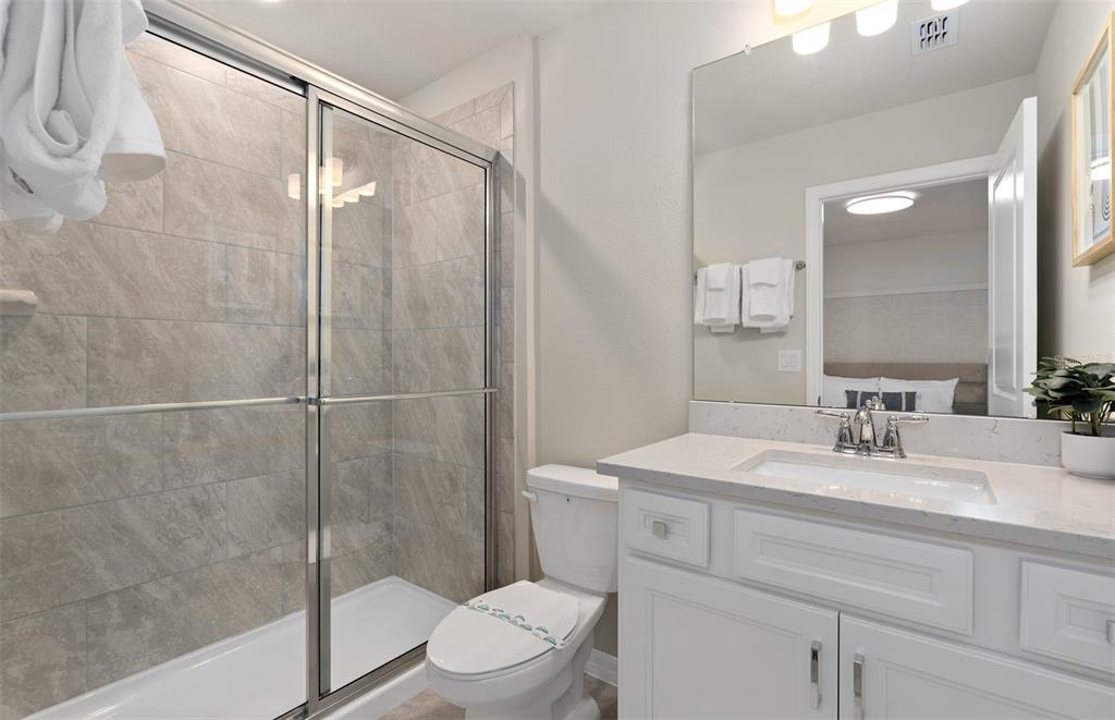 15918 Calm Key Loop Clermont, FL 34714 - Photo 57 of 57 a bathroom with a sink a toilet and shower