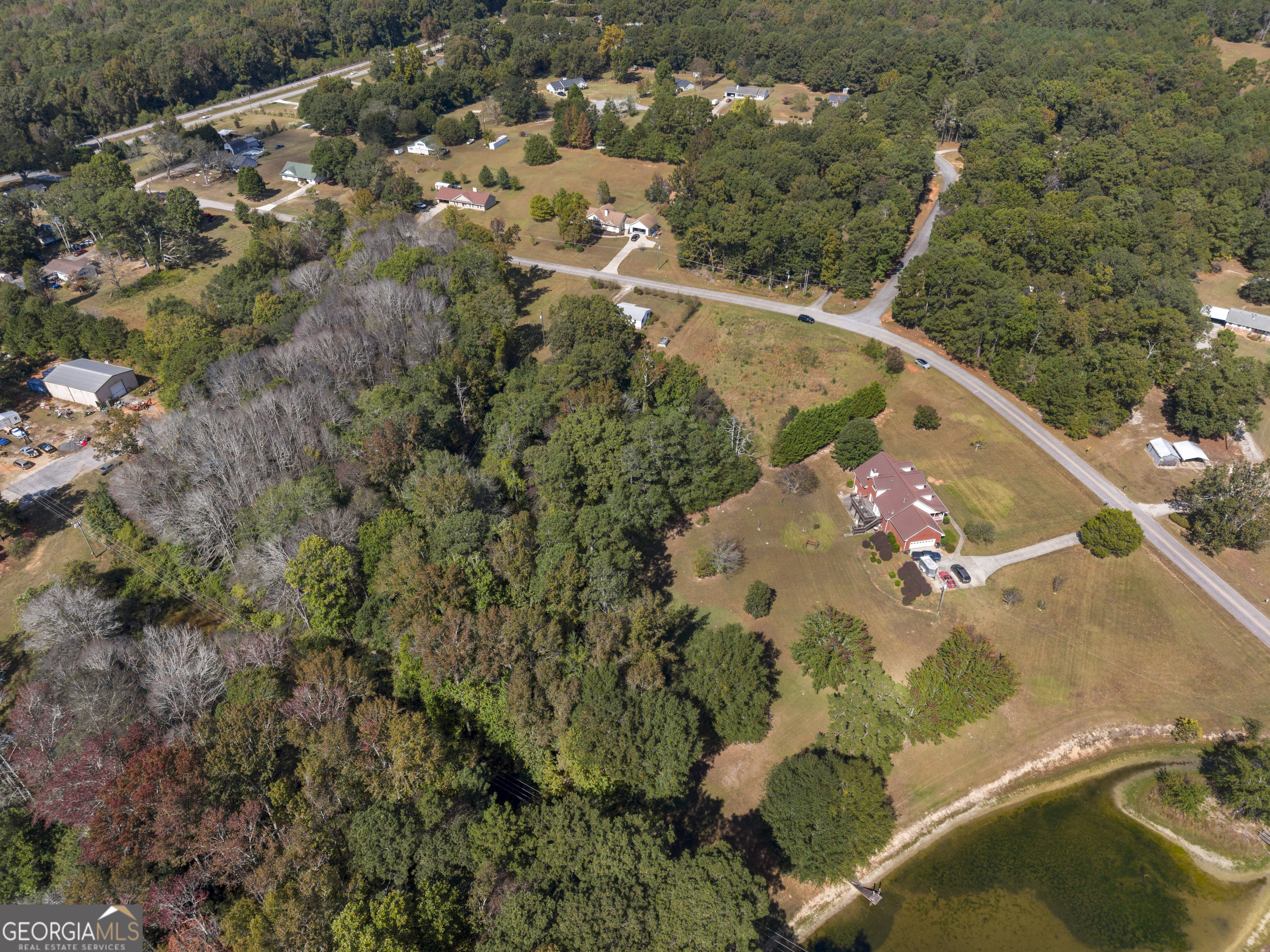 0 Dodgen Road Hampton, GA 30228 - Photo 6 of 16 an aerial view of a house with a yard