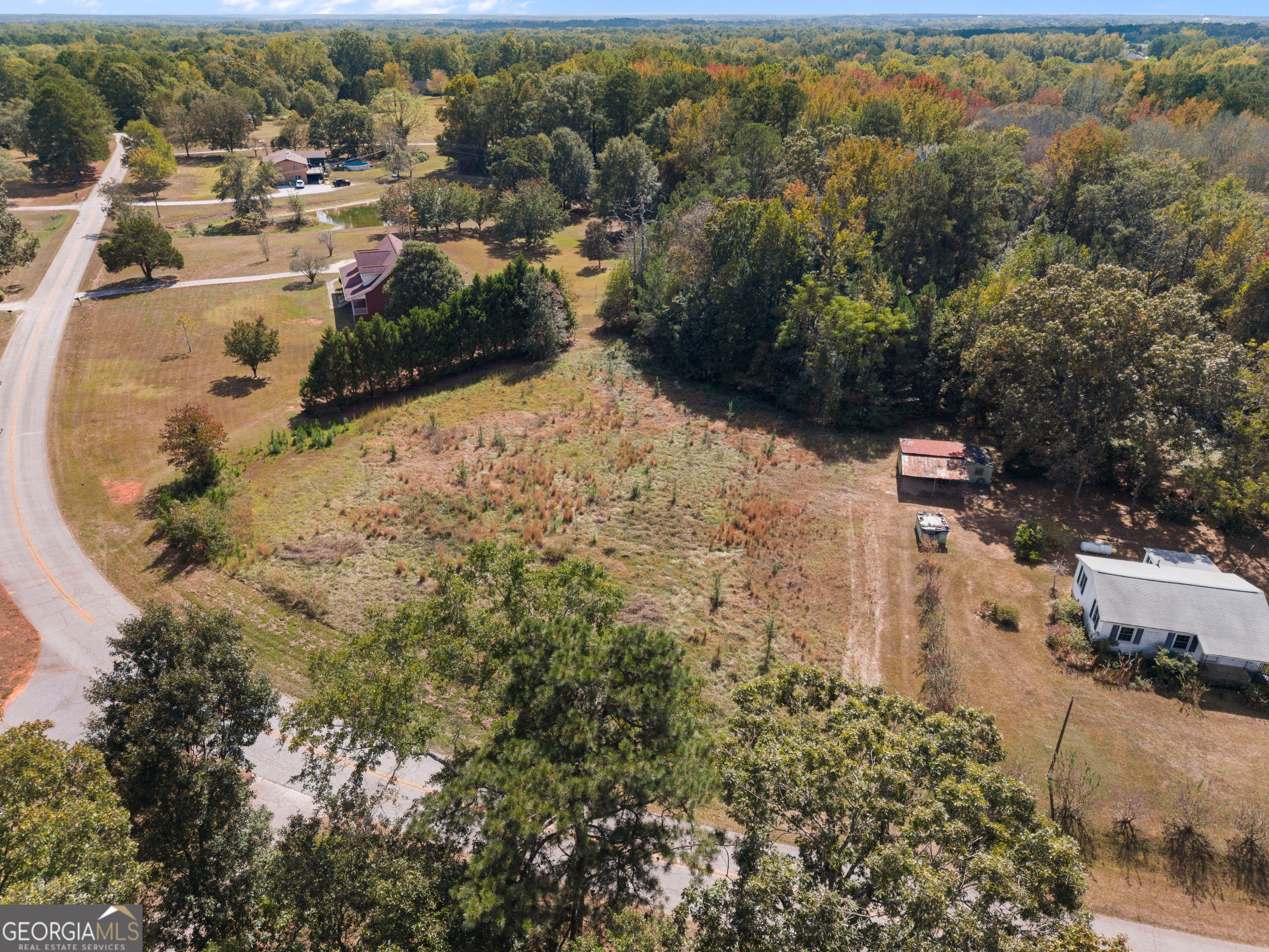0 Dodgen Road Hampton, GA 30228 - Photo 10 of 16 an aerial view of a house with a yard