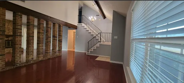 a view of entryway with wooden floor