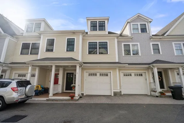 a view of a building with car parked