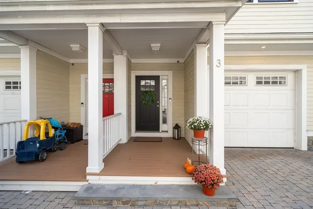 a view of living room filled with furniture and flowers