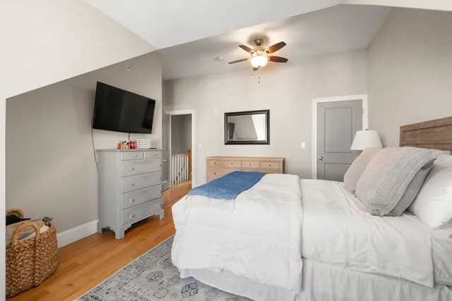 a bedroom with a bed and a television