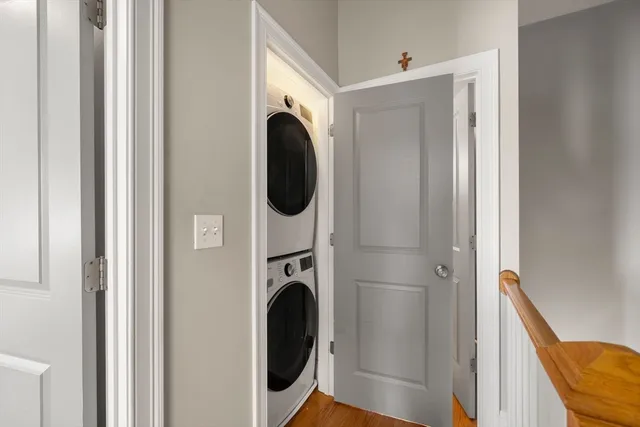 a view of a hallway with washer and dryer