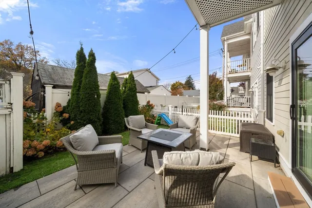 a view of a patio with couches chairs dining table and chairs