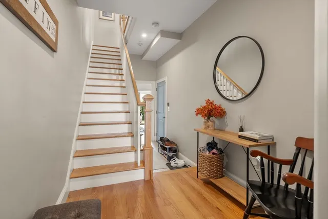 a view of a room with furniture and wooden floor