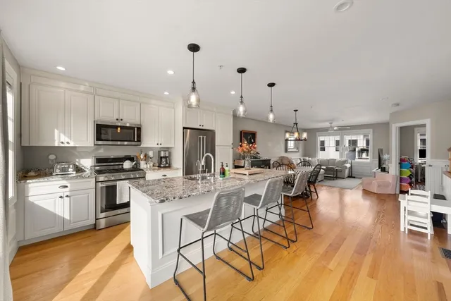 a large kitchen with lots of counter space a sink and appliances
