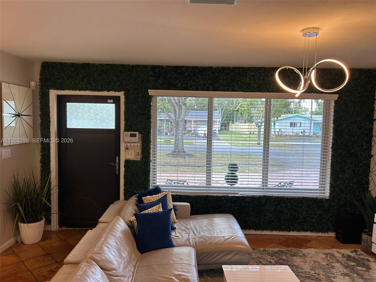 262 Southwest 54th Avenue Plantation, FL 33317 - Photo 15 of 16 a living room with furniture and a large window