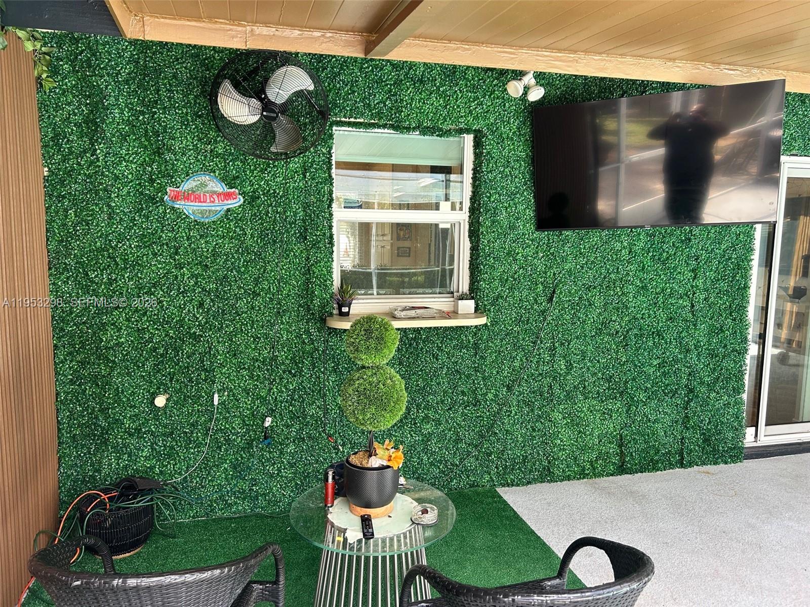 262 Southwest 54th Avenue Plantation, FL 33317 - Photo 6 of 16 a front view of a house with a yard