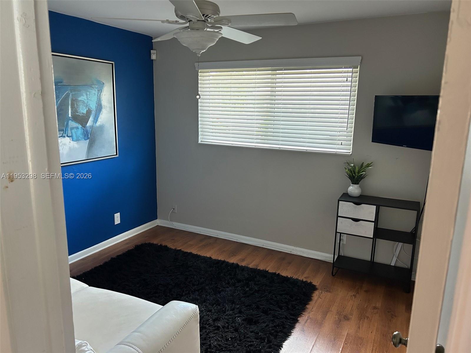 262 Southwest 54th Avenue Plantation, FL 33317 - Photo 8 of 16 a living room with a couch and a window