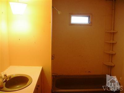 4381 Cochran Street, Unit 6 Simi Valley, CA 93063 - Photo 7 of 8 a bathroom with a sink and a toilet