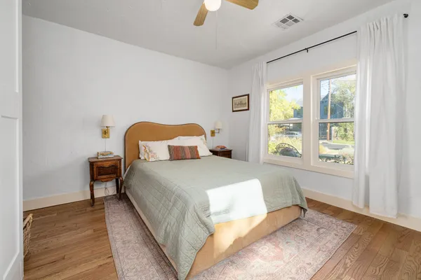 a bedroom with a bed and a window