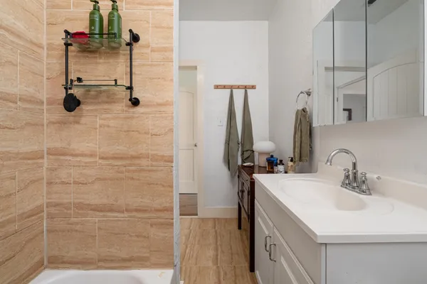 a bathroom with a sink and a mirror