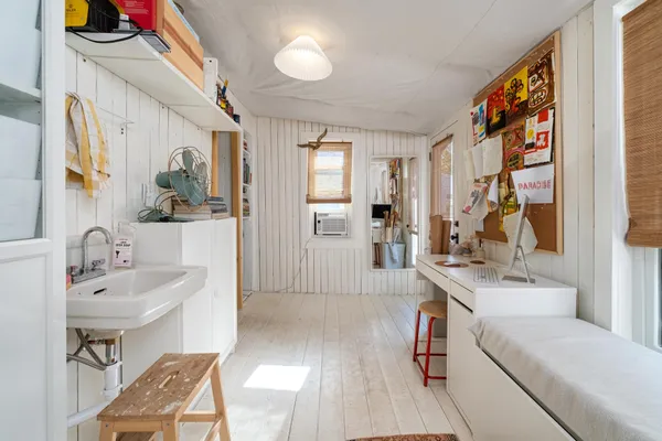 a spacious bathroom with a sink a mirror and a shower