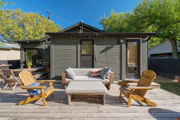 a patio with table and chairs