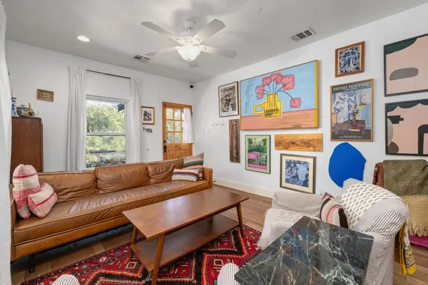 a living room with furniture fireplace and window