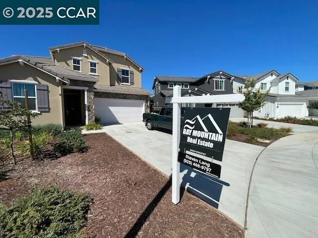 a front view of a house with parking