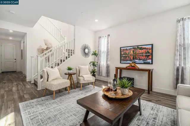 a living room with furniture and a table