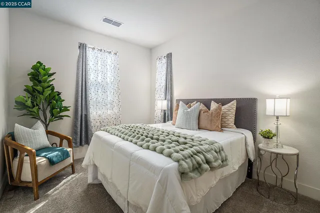 a bedroom with bed and a window