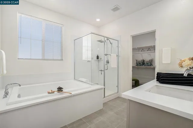 a bathroom with a bathtub and a sink