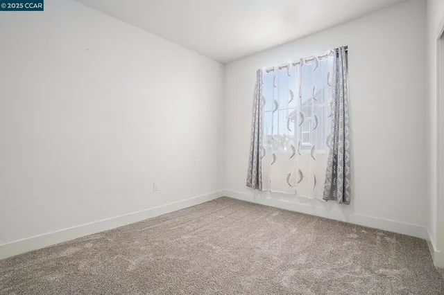 a view of room with window and gate