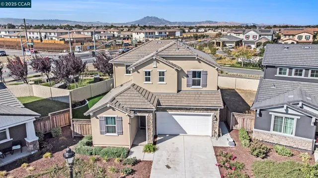 an aerial view of a house with a yard
