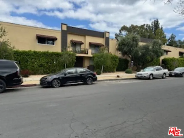 a view of street with parked cars