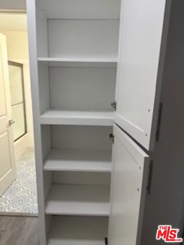 a kitchen with stainless steel appliances granite countertop a refrigerator stove and microwave