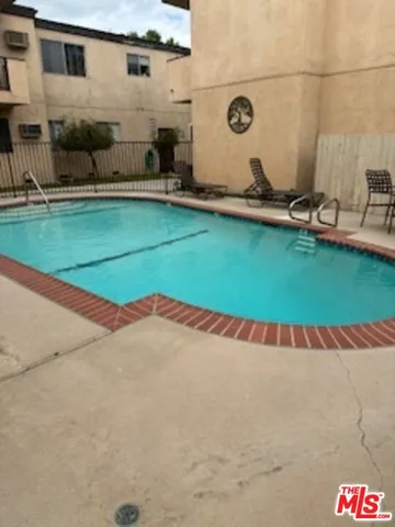 a view of a pool with a yard