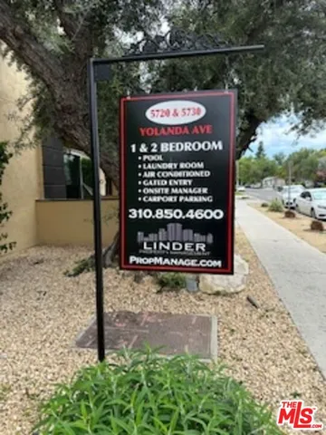 a sign on the side of the road