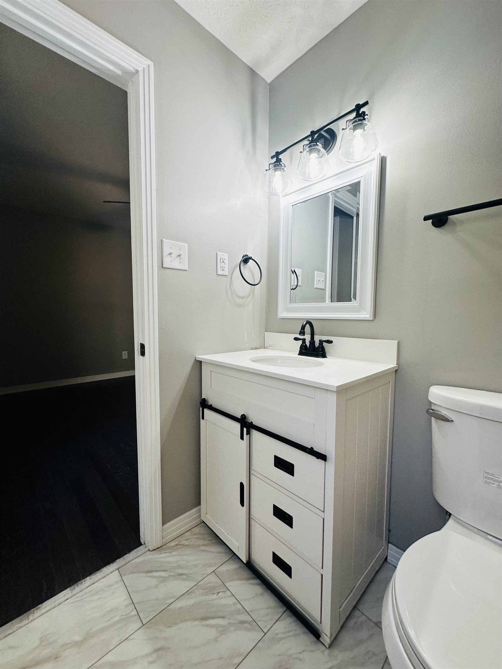 623 Bethesda-Purdy Road Selmer, TN 38375 - Photo 12 of 19 Bathroom featuring a textured ceiling, vanity, and toilet