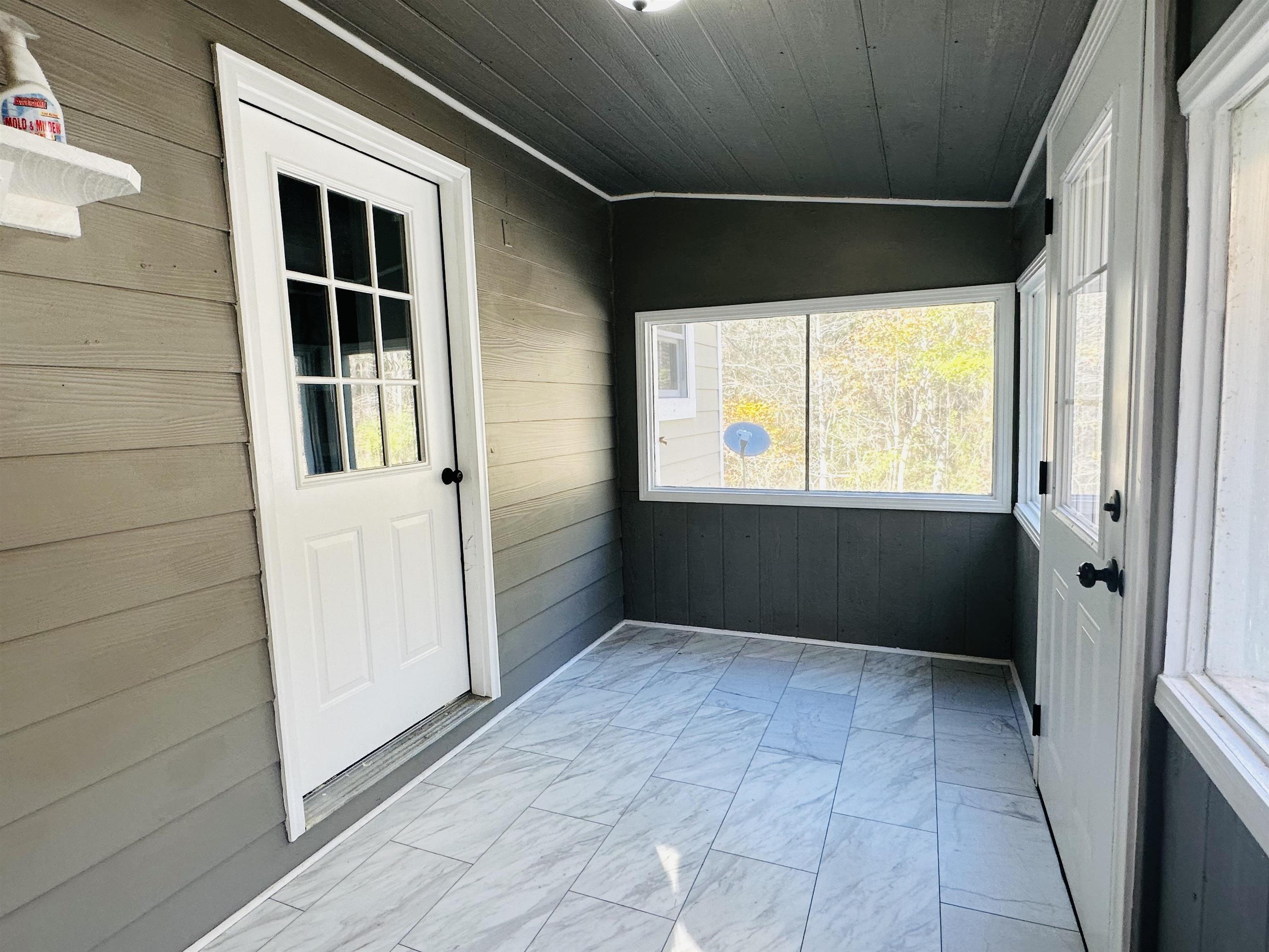 623 Bethesda-Purdy Road Selmer, TN 38375 - Photo 17 of 19 Unfurnished sunroom featuring wooden ceiling