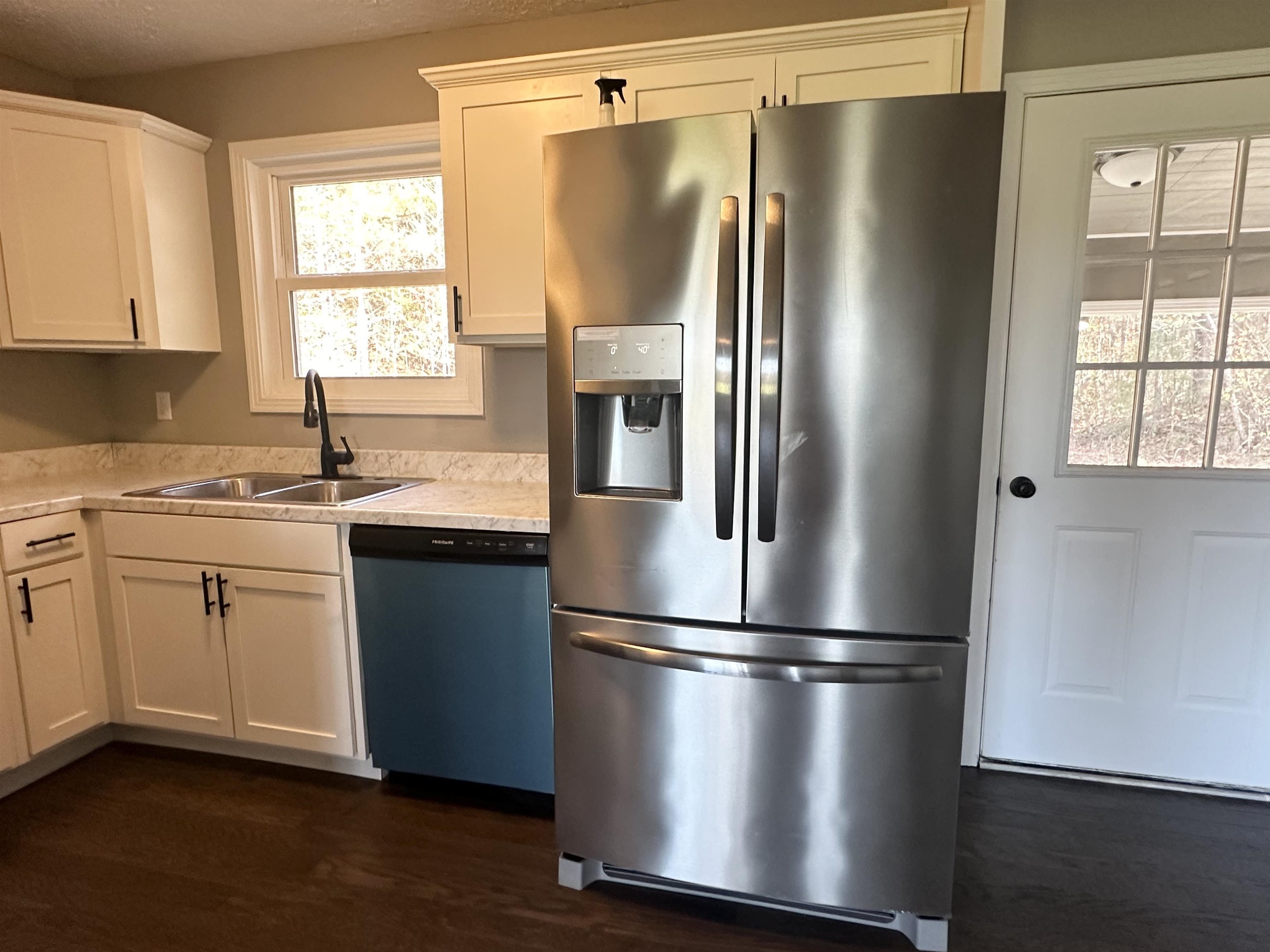 623 Bethesda-Purdy Road Selmer, TN 38375 - Photo 8 of 19 Kitchen featuring white cabinetry, sink, and appliances with stainless steel finishes