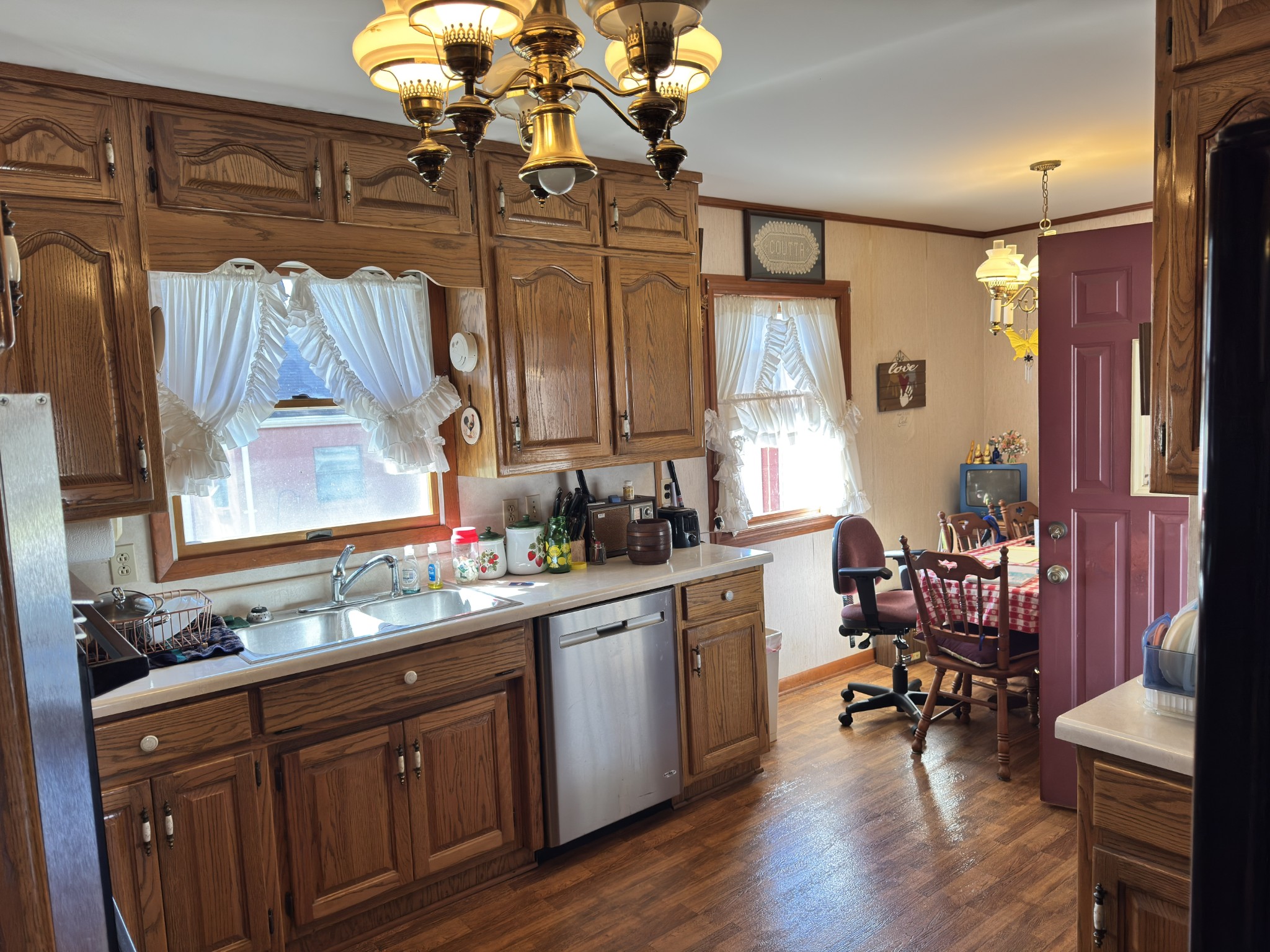 205 Mary Sharp Drive Decherd, TN 37324 - Photo 3 of 18 a kitchen with wooden cabinets and sink