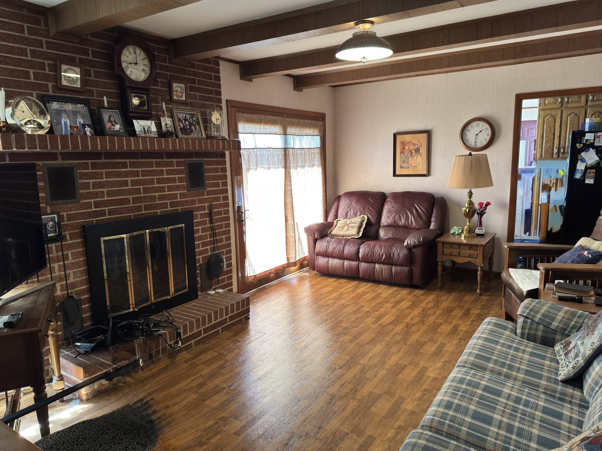 205 Mary Sharp Drive Decherd, TN 37324 - Photo 5 of 18 a living room with furniture a flat screen tv and a fireplace