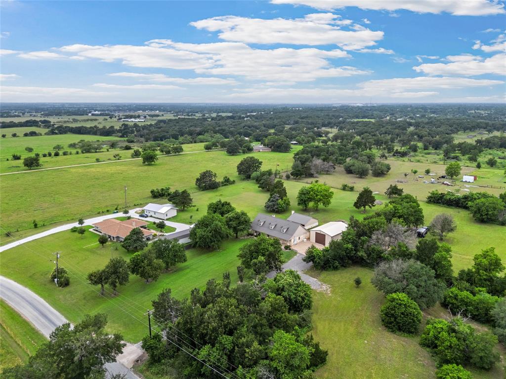 1117 Downsville Road Robinson, TX 76706 - Photo 36 of 40 Expansive rural property featuring multiple structures, verdant fields, and mature trees