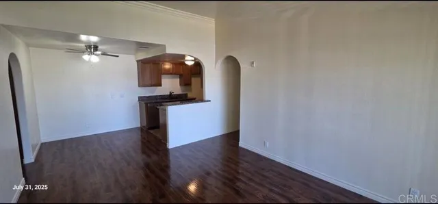 a view of a livingroom with wooden floor