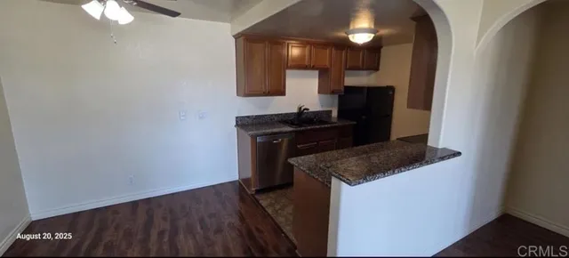 a kitchen with a sink and a stove