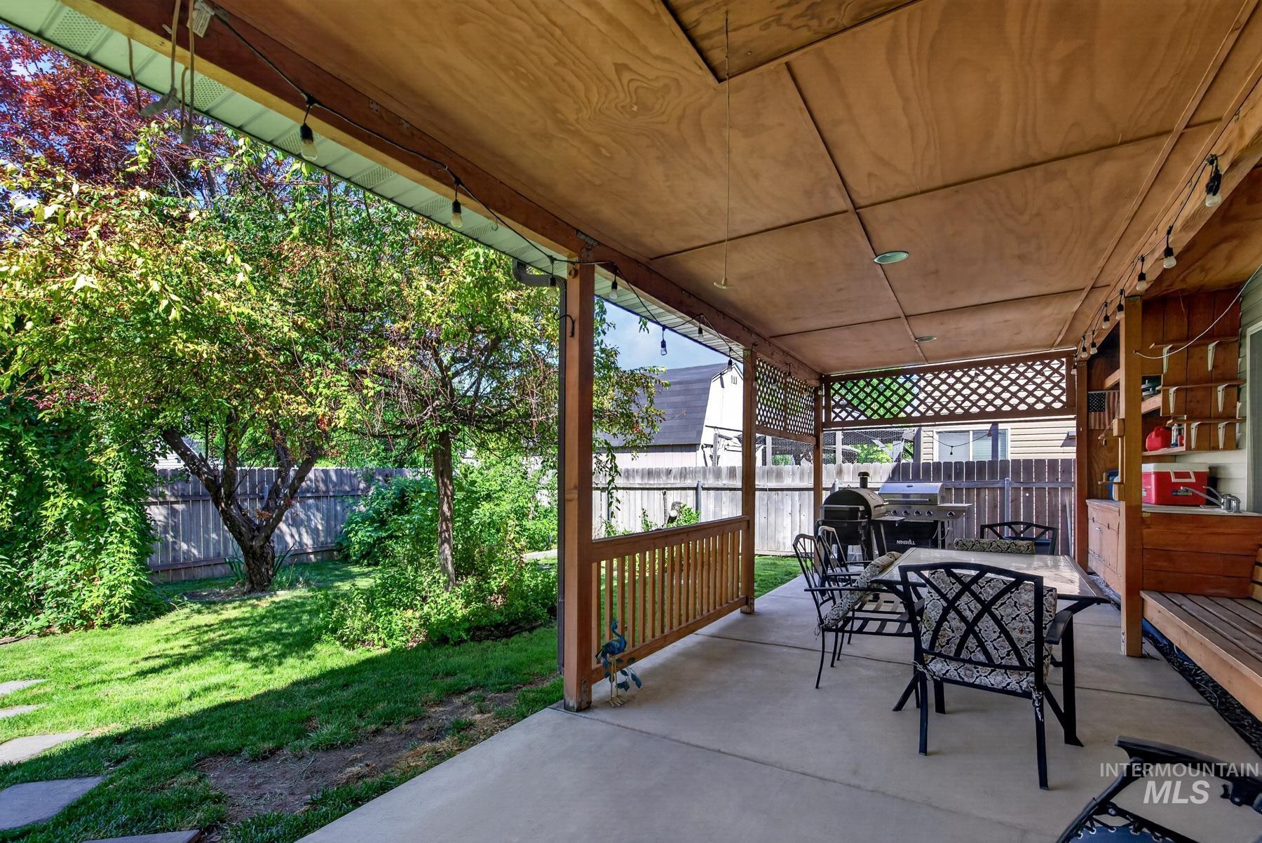 5020 Northrup Way Caldwell, ID 83607 - Photo 31 of 36 Covered patio featuring a wood-finish ceiling, concrete flooring, and lattice privacy screening