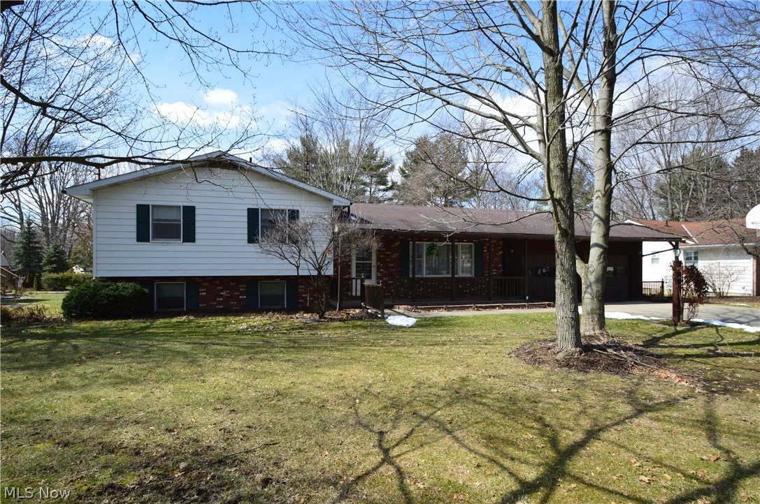 525 Howland Wilson Road Northeast Warren, OH 44484 - Photo 1 of 26 Front Exterior - Brick, Vinyl, & Wood.