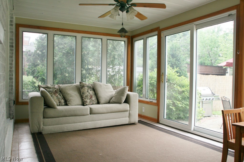 2452 Dysart Road Cleveland, OH 44118 - Photo 12 of 22 Enjoy the outdoors from the comfort of the terrific three season sun porch with ceramic tile floors, ceiling fan and sliding glass doors that open to patio.