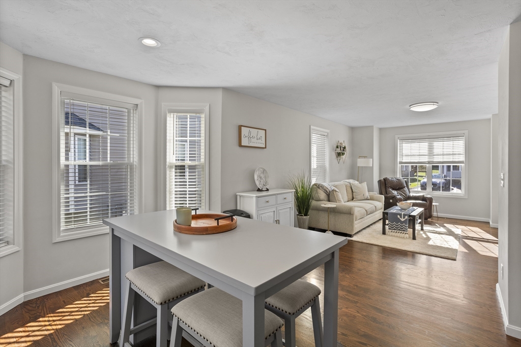 45 Riley Road, Unit 45 Tyngsborough, MA 01879 - Photo 14 of 42 a living room with furniture and wooden floor