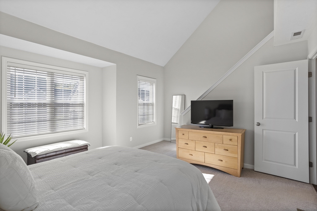 45 Riley Road, Unit 45 Tyngsborough, MA 01879 - Photo 24 of 42 a bedroom with furniture and flat screen tv
